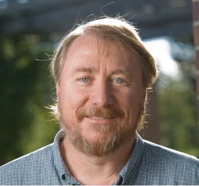 Dynamics of Phenotypic and Genomic Evolution in a Long-Term Experiment with E. coli logo